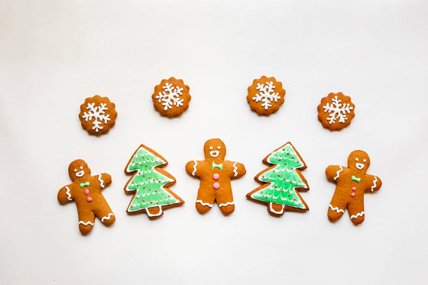 Handmade festive gingerbread cookies in the form of stars and Christmas trees and hearts for Valentine's Day - Photo, Image