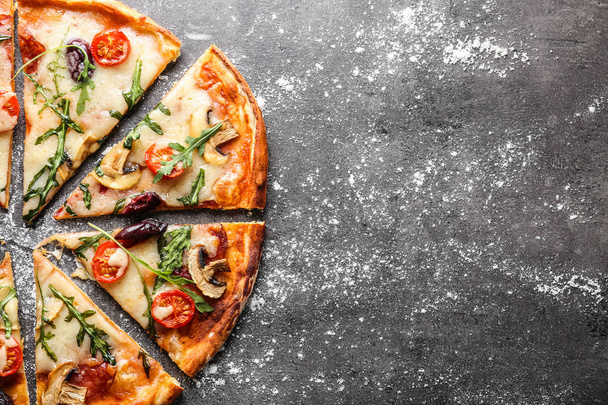 Delicious pizza on grey background - Foto, afbeelding