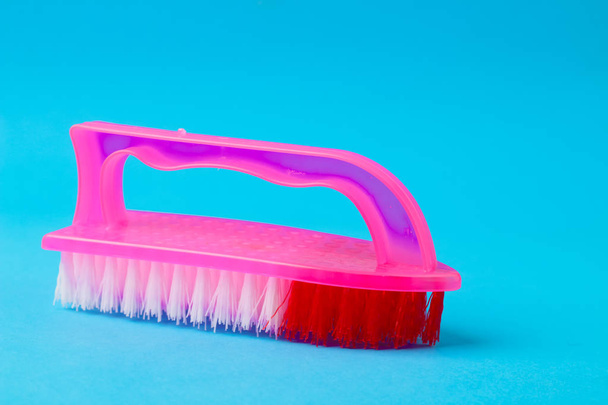 cleaning brush on a blue background - Foto, imagen