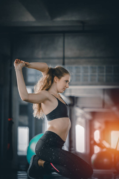 Portrait young attractive healthy woman body curve fitness doing exercises workout with ball in gym. People beauty perfect body slim fitness girl. Freedom happy and relax lifestyle healthcare concept. with copy space. - Photo, Image
