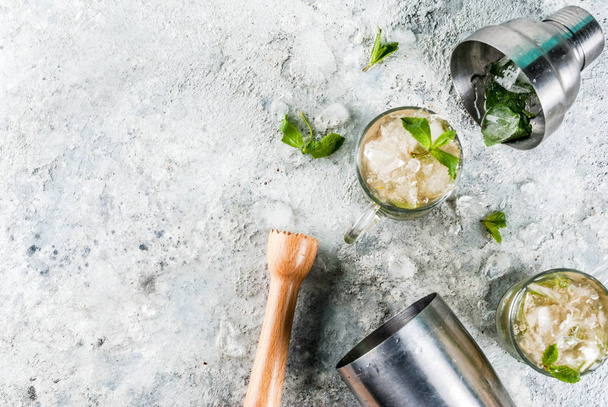 Cold summer beverage, mint julep cocktail drink, grey stone background copy space - Фото, изображение