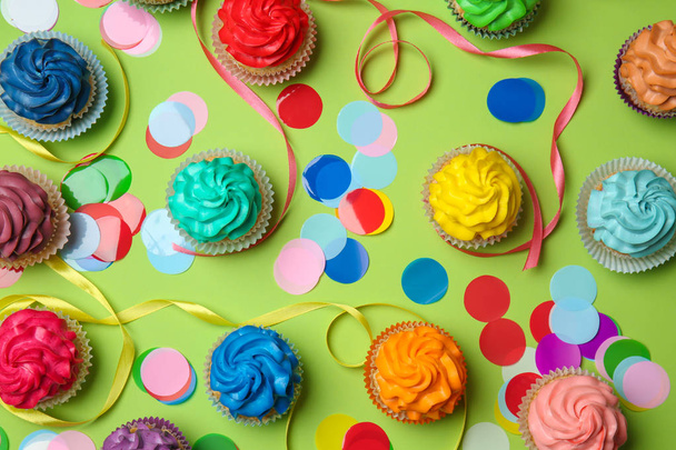 Different cupcakes on color background - Valokuva, kuva