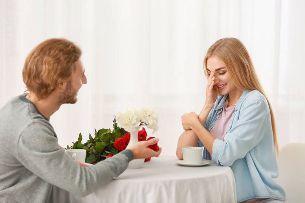 Young man proposing to his beloved on romantic date - Photo, Image