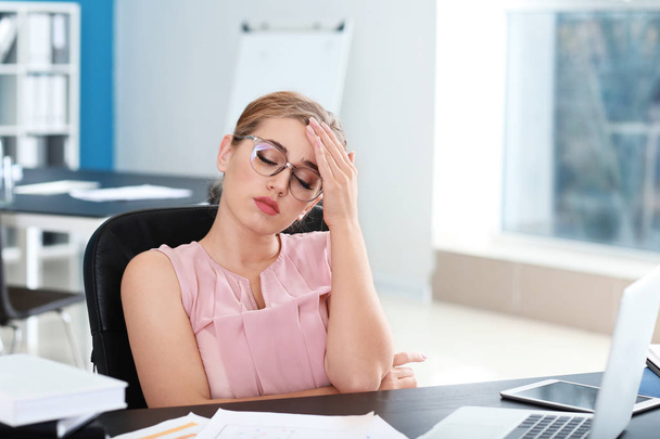 Stressed businesswoman working in office - Photo, Image