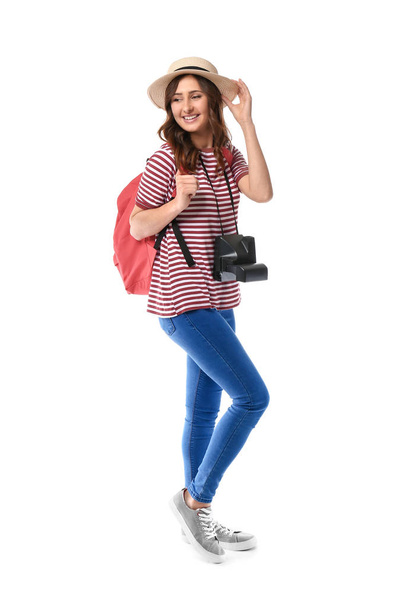 Young female tourist on white background - Foto, afbeelding