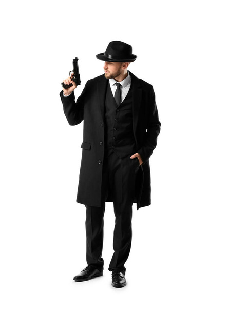 Detective with gun on white background - 写真・画像
