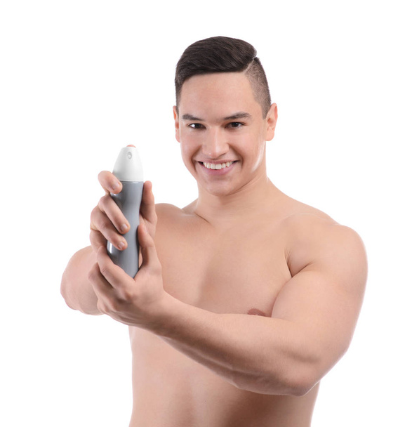 Young man with deodorant on white background - Photo, Image