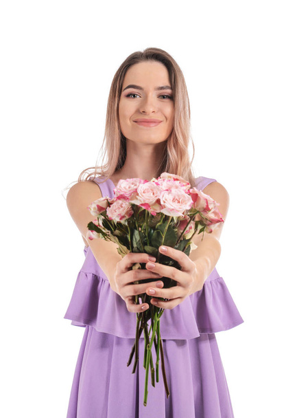 Beautiful young woman with bouquet of flowers on white background - Foto, Imagen