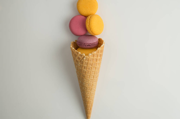 Cake macaron or macaroon on white background from above, colorful almond cookies, top view. - Valokuva, kuva