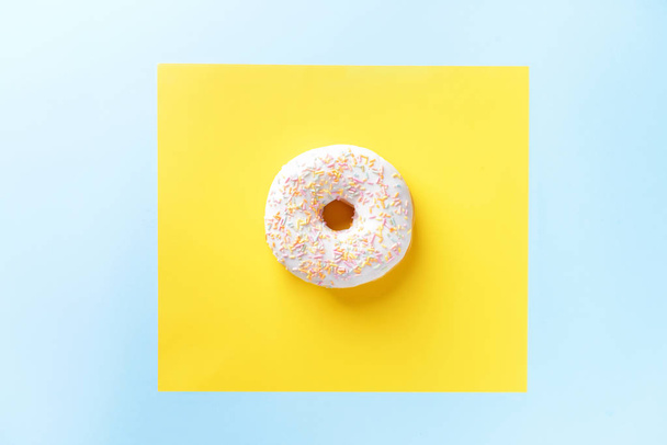 Tasty doughnut on color background - Zdjęcie, obraz