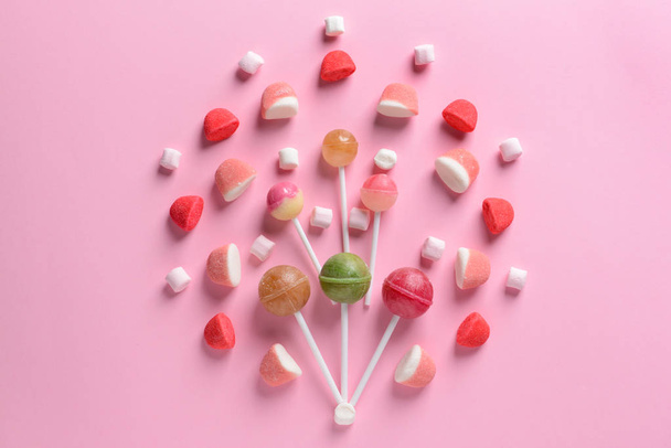 Assortment of tasty candies on color background - Photo, Image