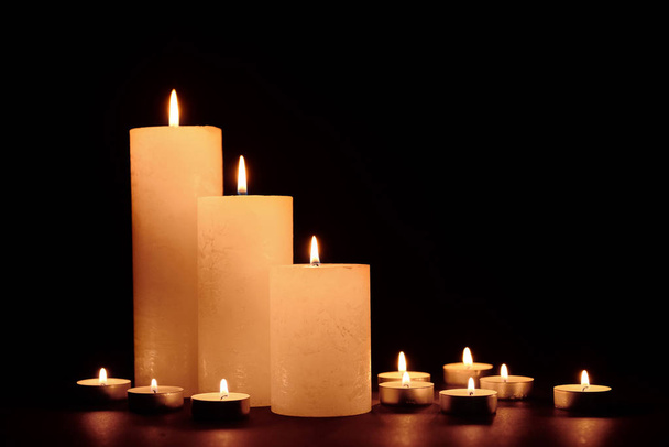 Beautiful burning candles on dark background - Fotoğraf, Görsel