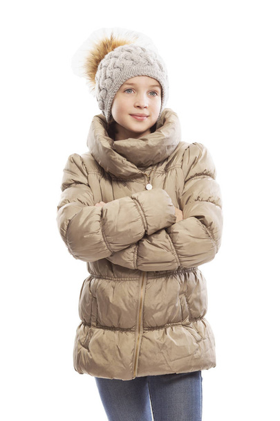 Cute teen girl in winter jacket and hat, isolated on white background - Fotografie, Obrázek