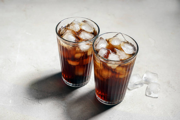 Glasses of tasty soda with ice on table - Photo, image