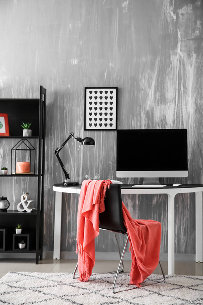 Stylish workplace with modern computer near grey wall - Photo, image
