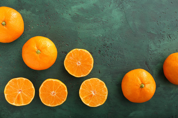 Tasty tangerines on color background - Foto, imagen