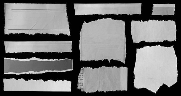 Diez pedazos de papel roto sobre negro
 - Foto, imagen
