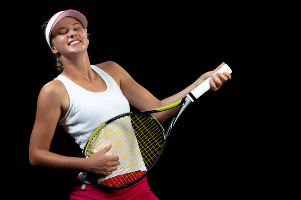 Smiling tennis player playing on racket as on guitar - Zdjęcie, obraz