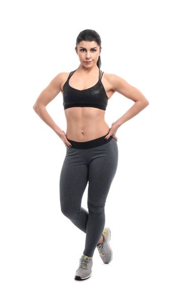 Sporty muscular woman on white background - Foto, imagen