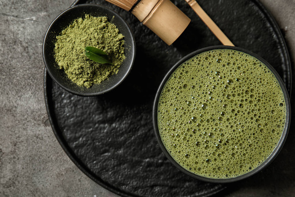 Composition with matcha tea on table - Photo, image