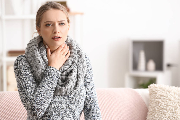 Young woman having asthma attack at home - Valokuva, kuva