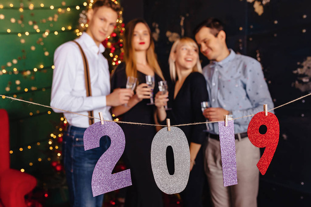2019 numbers new year party, christmas tree at home - Foto, Imagen