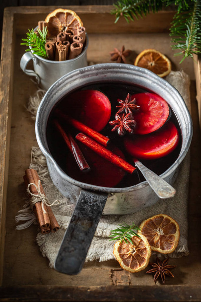 Tasty and homemade mulled red wine with cloves and anise - Fotoğraf, Görsel