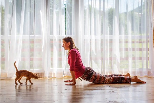 Caucasian woman is practicing yoga at studio - Valokuva, kuva