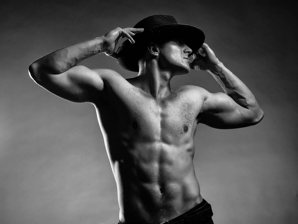 Sexy muscular man in hat - Valokuva, kuva