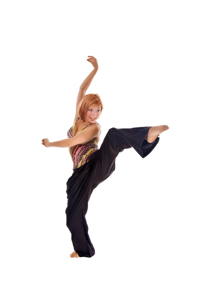 Red haired girl performing fitness exercises - Valokuva, kuva