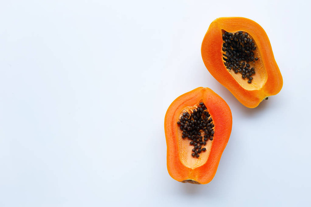Slices of papaya fruit on a white background. Copy space - Foto, Imagen