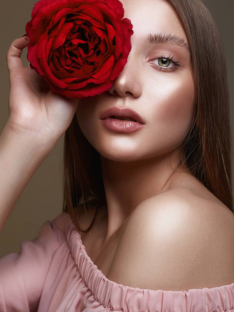 Beautiful young Woman with Flower. Lovely girl with beauty make-up and Rose. beauty portrait.wet makeup - Photo, Image
