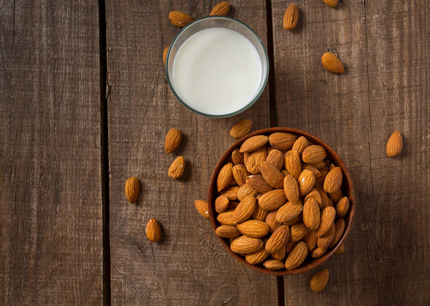 glass of almond milk on wooden surface - Zdjęcie, obraz