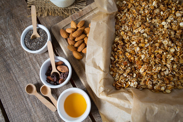 homemade healthy granola on wooden surface  - Zdjęcie, obraz