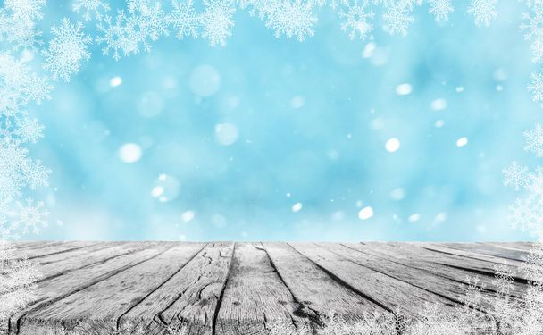Holztisch und Winter Schnee Hintergrund mit Schneeflocken - Foto, Bild