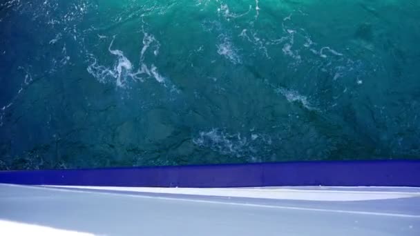 Beautiful blue Adriatic sea comming out below side of moving ferry boat. Filmed on vacation trip to Croatian island Pasman. - Footage, Video