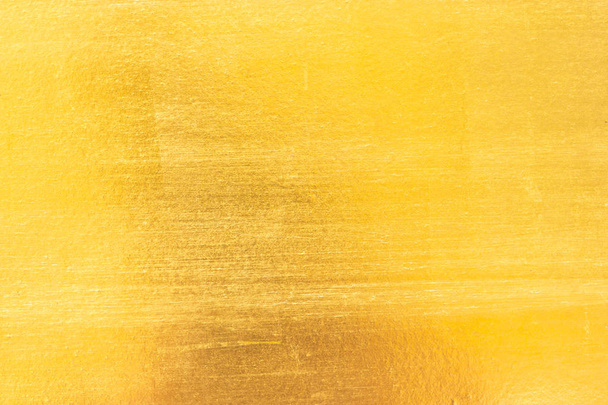 glanzend geel blad goud folie textuur achtergrond - Foto, afbeelding