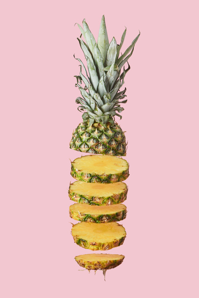 sliced sweet organic pineapple isolated on pink  - Фото, изображение