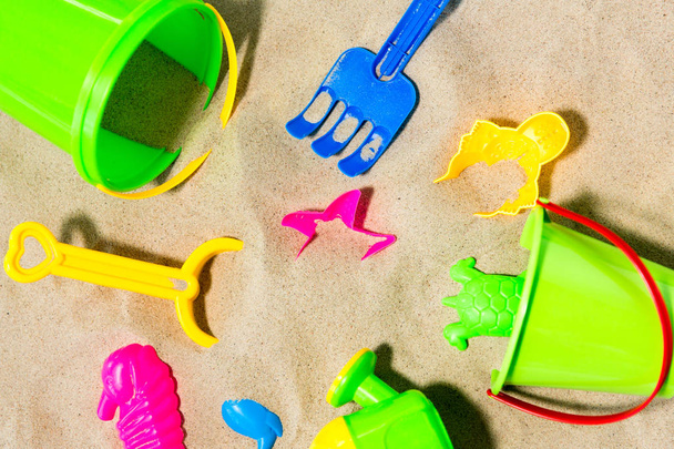 close up of sand toys kit on summer beach - Foto, Imagen