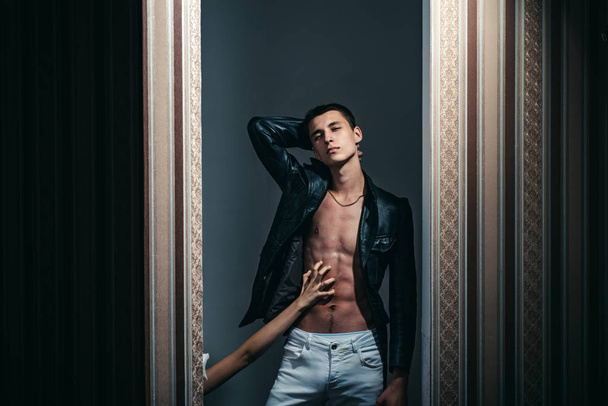 Confident and successful. Male fashion and style. Fashion portrait of man. Macho man with six pack. Sexy muscular man. girl touch his belly with hand. Stylish and confident - 写真・画像