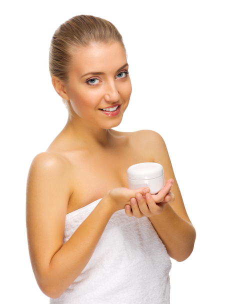 Young happy woman holding jar with body cream - Zdjęcie, obraz