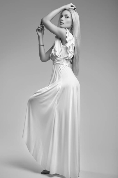 Portrait of gorgeous sensual blonde woman in fashion antique white dress isolated on bright studio background - Photo, Image