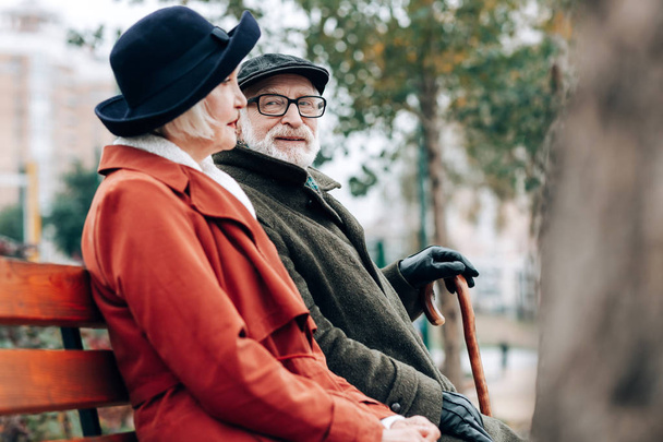 Handsome pensioner staring at beautiful senior woman - Foto, afbeelding