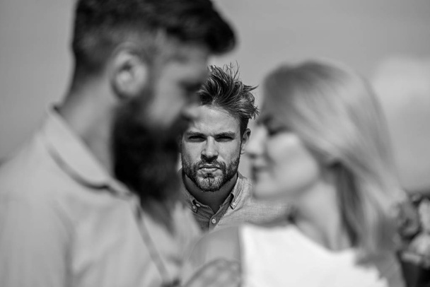 Couple romantic date lovers flirting. Couple in love happy dating, jealous man watching woman prefers another macho instead him. Lovers meeting outdoor flirt romance relations. Broken heart concept - Foto, afbeelding
