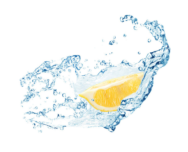 Cut fresh lemon and splashing water on white background - Photo, image