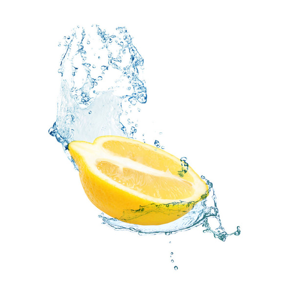Cut fresh lemon and splashing water on white background - Photo, Image