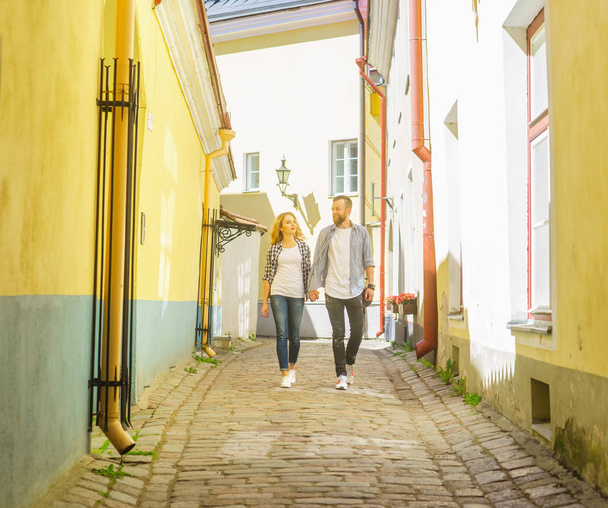 Young loving couple have dating outdoor. Man and woman walking in a city streets. Love, relations and date concept. - Foto, Bild