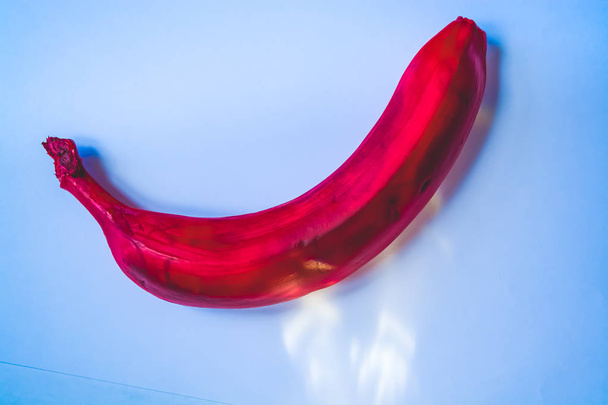 Colored bananas on a monophonic background.  White and pink. - Photo, Image