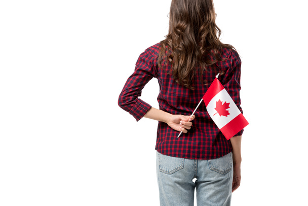 back view of woman holding canadian flag isolated on white - Fotografie, Obrázek