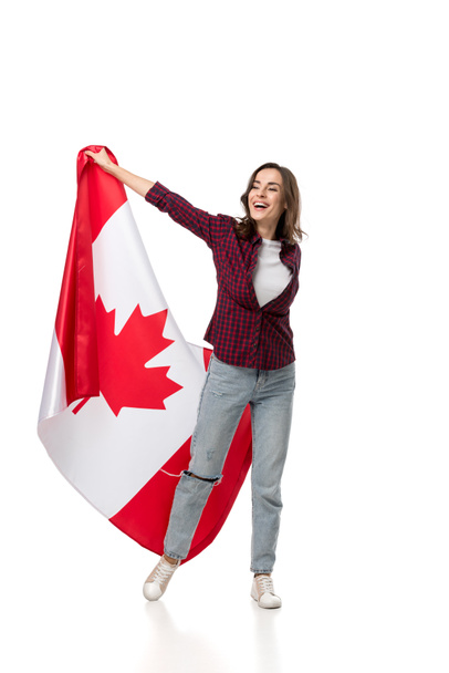 cheerful woman holding canadian flag isolated on white - Foto, afbeelding